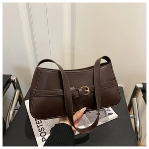 Close-up of a dark brown faux leather baguette bag with a stylish metal buckle strap