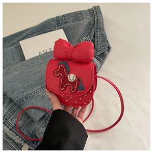 Detail of red quilted mini crossbody bag with 3D bow and pony embroidery feature
