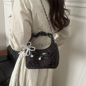 Elegant black ruched handbag with pearl studs and chain strap for stylish women