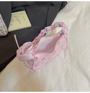 Pink floral hobo bag with textured seersucker fabric and scrunchie-style shoulder strap