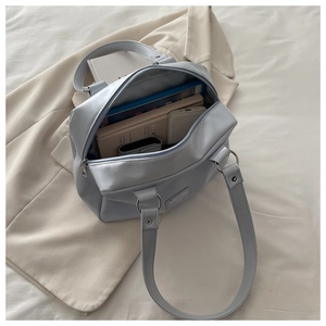 Detailed interior of the large grey oil wax leather tote showing its spacious capacity