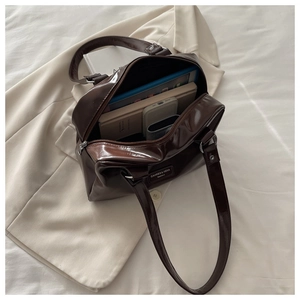Detail view of spacious brown oil-wax leather handbag interior showing large storage capacity