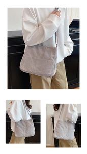 Detail of light grey corduroy tote bag showing ribbed texture and spacious front pocket