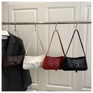 Minimalist glossy shoulder bags in dark brown, white, red, and black with belt buckles