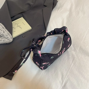 Chic black floral tote bag with pink rose patterns and pleated texture for a retro style