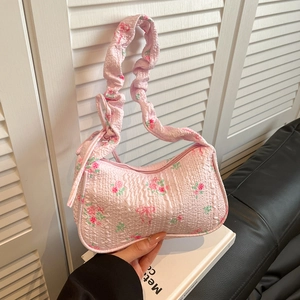 Pink floral shoulder bag with ruched strap and rose patterns in a casual aesthetic