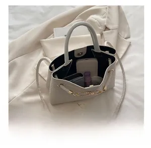 Top view of white woven tote bag showing spacious interior with daily essentials