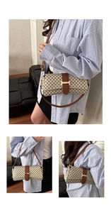 Detail of vintage monogram baguette bag with brown leather trim and golden H buckle