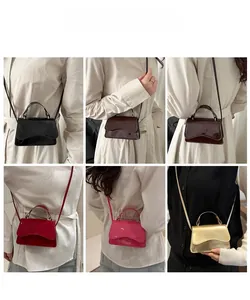 Close-up of contrast mini crossbody bags in six vibrant colors with wave-shaped flaps
