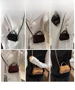 Model display of minimalist crossbody mini bag in multiple colors with top handle and strap