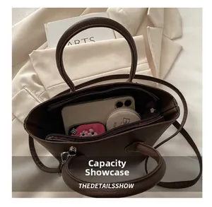 Interior view showing large capacity of the brown lychee leather tote bag for essentials