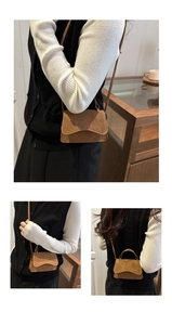 Three-way view of brown suede mini crossbody bag with wavy flap and top handle