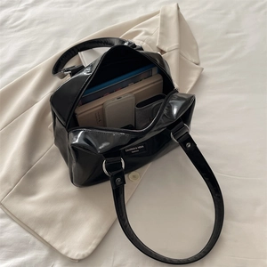 Large capacity black oil wax leather shoulder bag with spacious interior and silver hardware