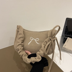 Japanese style khaki corduroy crossbody bag with frilled shoulder strap and bow details