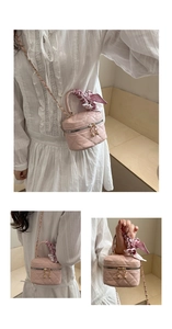 Pink quilted mini bag details featuring a floral silk scarf handle and golden chain strap