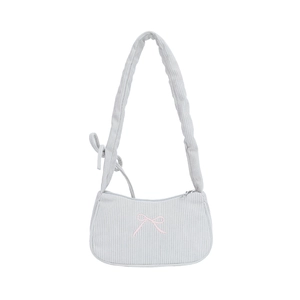 Minimalist corduroy shoulder bag in light blue with pink embroidered bow and ribbed texture