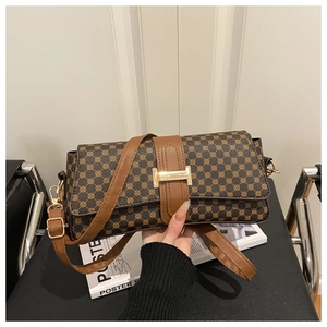 Detail of vintage brown monogram shoulder bag with gold metal buckle and leather strap
