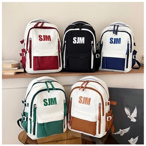 Close-up of stylish contrast-color school backpacks in five various color combinations
