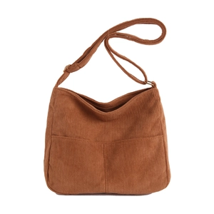 Retro corduroy tote bag in caramel brown featuring dual front pockets and adjustable strap