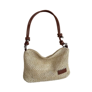 Minimalist beige woven straw shoulder bag with dark brown PU leather strap and crescent shape