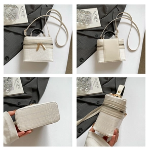 Detailed four-way view of white croc-embossed mini box bag with dual zip and top handle
