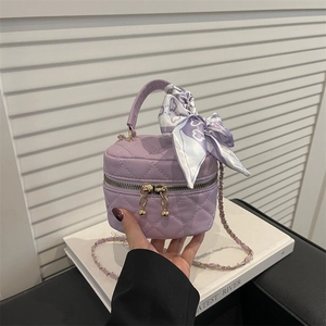 Chic lavender quilted mini bucket bag with silk scarf handle and gold chain strap