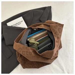 Spacious leopard print tote bag interior showing books, umbrella and magnetic closure