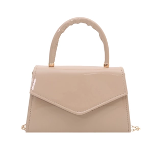 Minimalist beige glossy patent leather handbag with gold chain strap and top handle