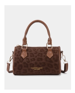 Detail of leopard print Boston bag featuring gold hardware and leather handles