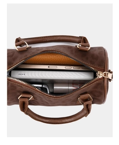 Top view of a brown Boston bag showing a spacious interior for phone and cosmetics