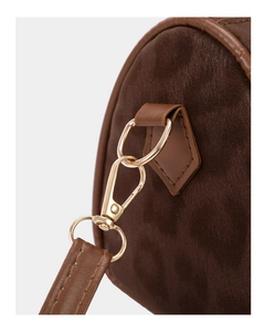 Detailed close-up of dark brown suede texture and gold metallic lobster clasp hardware