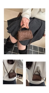 Detail of brown leopard print micro handbag with curved flap and cylindrical handle