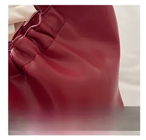 Close-up of red PU leather bridal tote showing soft pleated texture and fine craftsmanship
