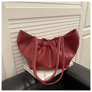 Detail view of burgundy pleated dumpling bag with soft PU leather and adjustable strap