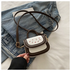 Mini color-block crossbody bag with cherry pattern and adjustable gold metal buckle