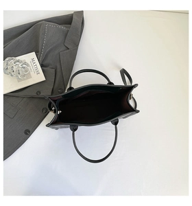 Top view of large capacity deep green tote bag with dual handles and adjustable strap