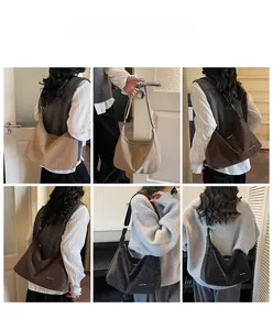 Tre grandi borse hobo minimaliste in camoscio beige, marrone e nero indossate da una modella