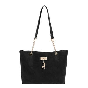 Large black tote bag with gold chain strap and deer pendant on white background