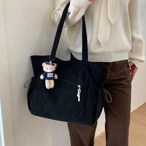 Large black corduroy tote bag with side drawstrings and a cute teddy bear charm
