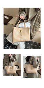 Close-up of beige tote bag with textured faux leather and gold oval metallic buckle