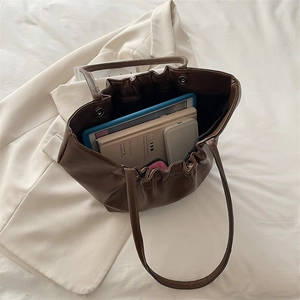 French pleated dark brown cloud tote bag showing large capacity for daily essentials