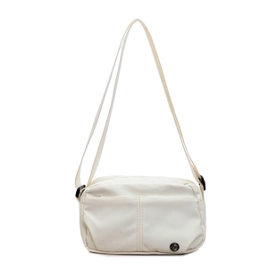Minimalist cream-white crossbody bag for women with round metal logo and nylon strap