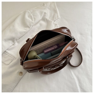 Spacious interior of brown vintage tote bag showing capacity for daily essentials