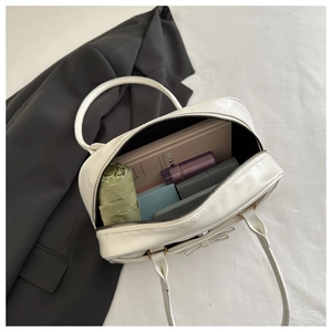 Top view of white Boston bag interior showing spacious storage for daily essentials