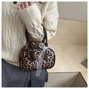 Leopard print mini Boston bag with white lace bow and brown leather handles detail