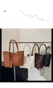 Detailed display of high-capacity tote bags in four colors with matching mini pouches