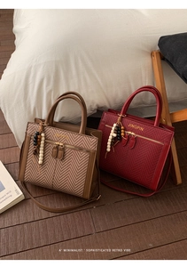 Detail of vintage tote bags in brown herringbone and red woven texture with bead charms