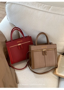 Detail showing vintage textured tote bags with leather trim and herringbone fabric patterns