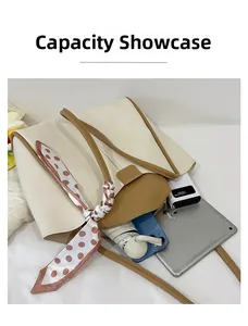 Detail showing high capacity of two-tone tote bag with iPad and daily essentials