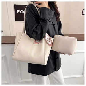 Minimalist beige tote bag set with matching pouch and decorative polka dot silk scarf